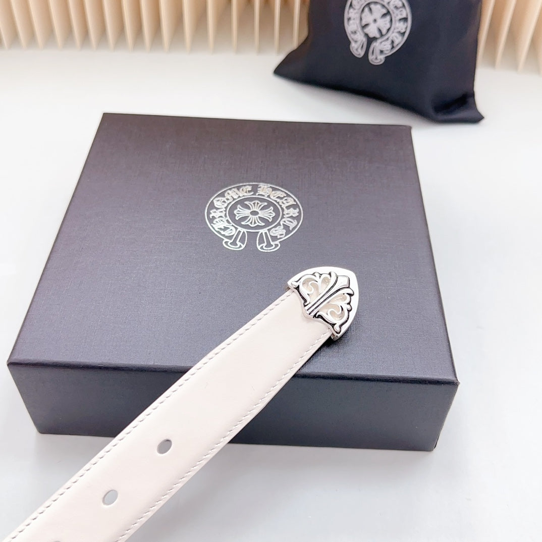 Beige leather belt with ornate chrome buckle and engraved crest detail
