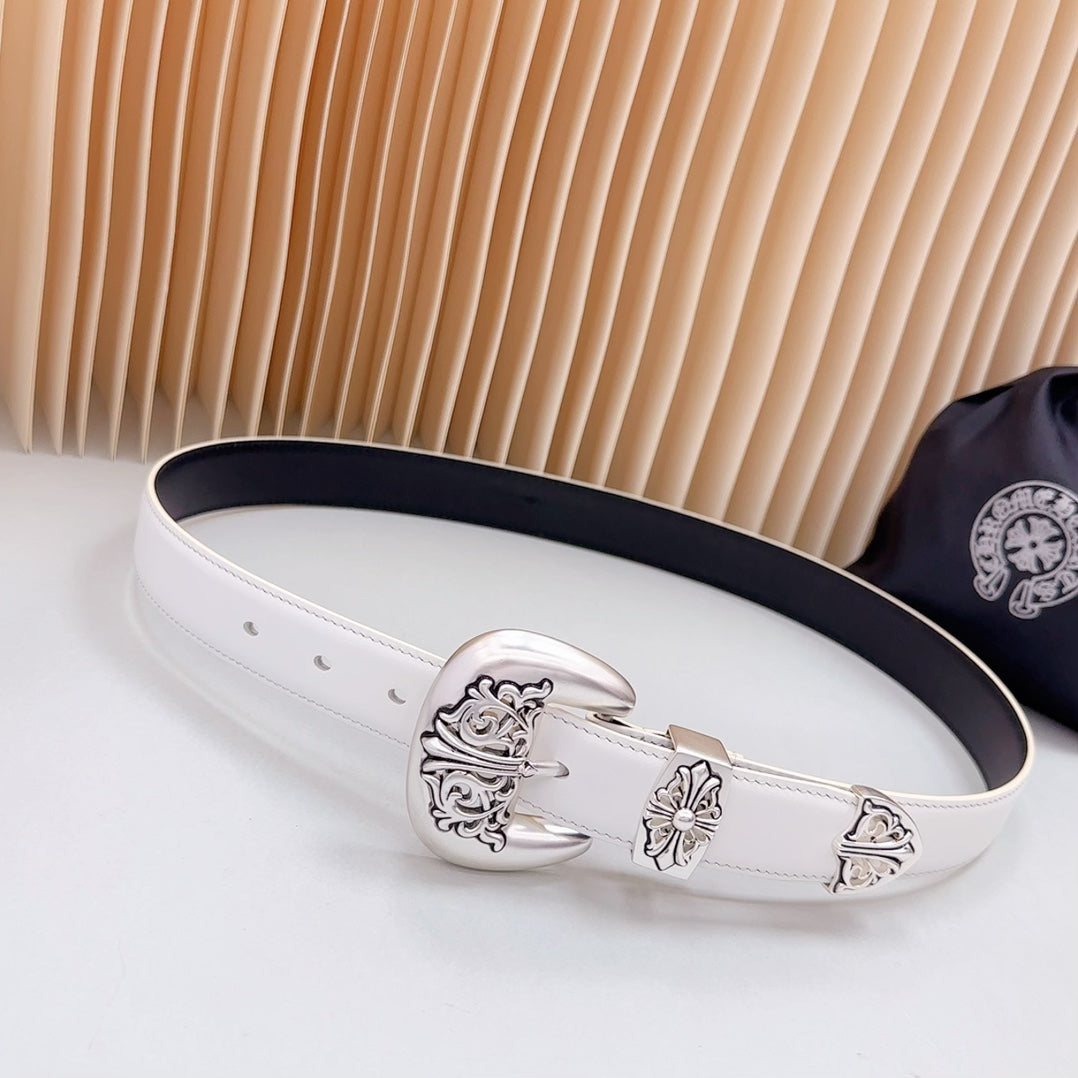 White leather belt with silver ornate buckle and keeper detail