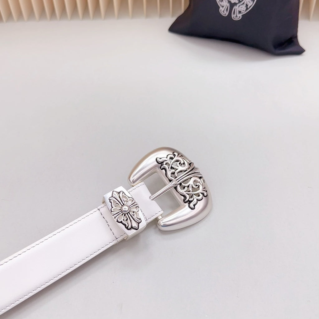 White leather belt with silver buckle featuring floral filigree