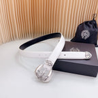 White leather belt with silver buckle, dark underside, and ornate medallions