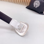 White leather belt with silver buckle and dark strap end