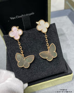 Butterfly drop earrings with white clover tops and gold-tone chain drops