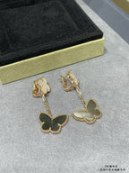 Butterfly dangle earrings with dark green butterfly charms on gold-tone chains