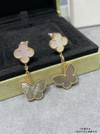 Butterfly drop earrings with white clover tops and pale green butterfly charms on chains