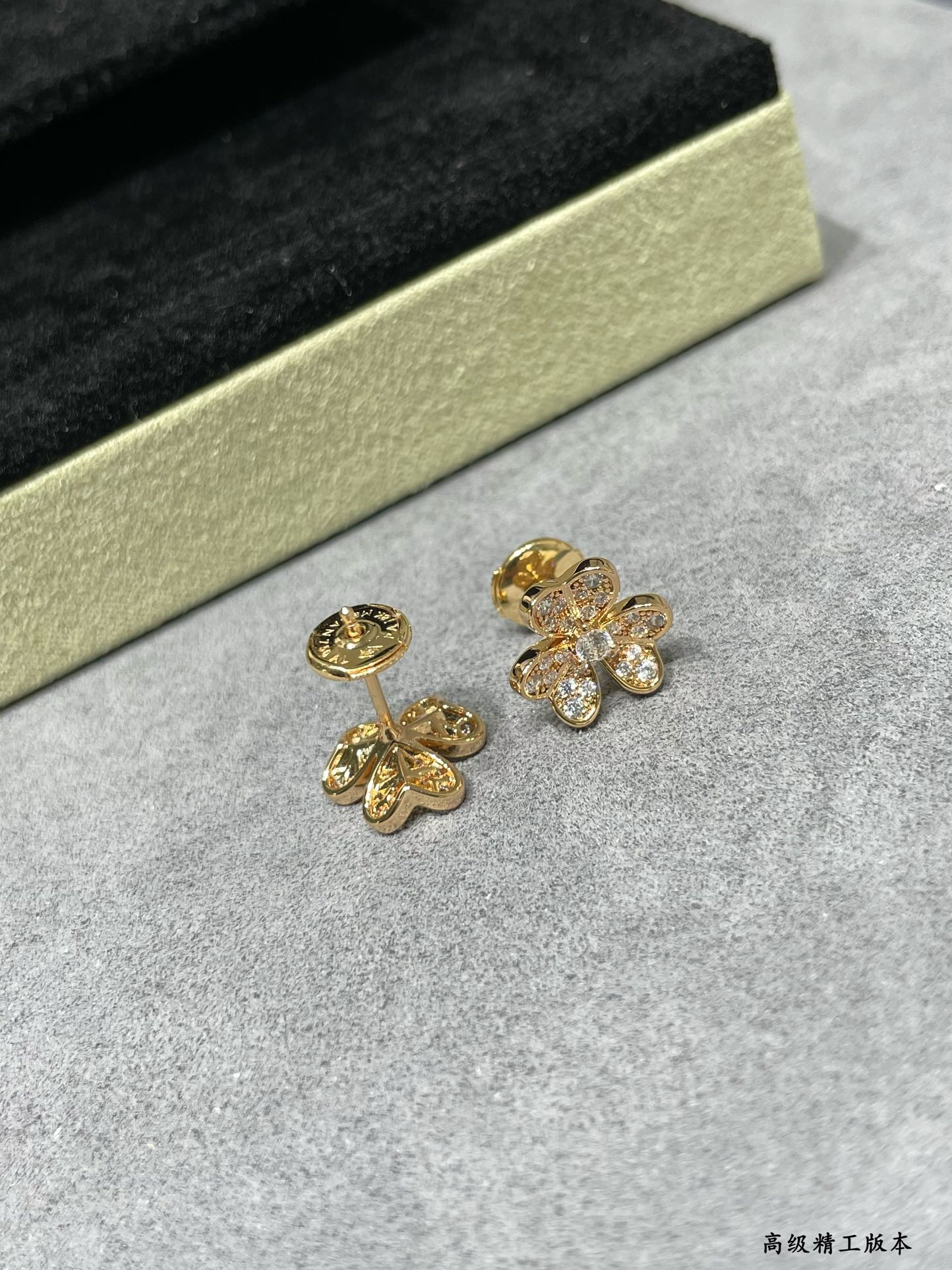 Four-leaf clover stud earrings in yellow gold tone with clear stones
