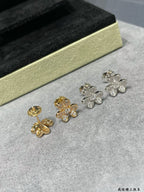 Four-leaf clover stud earrings in yellow and white gold tones