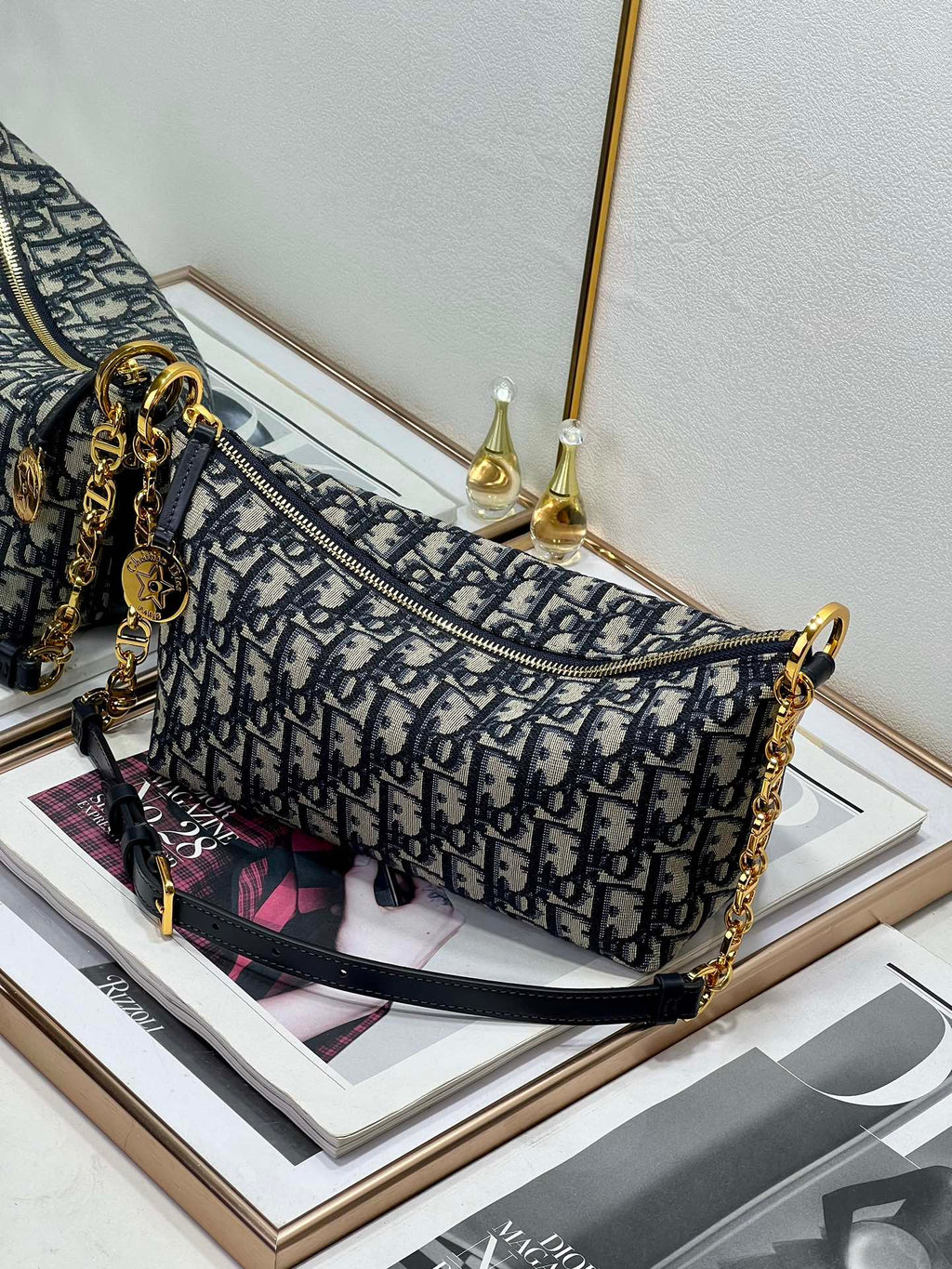 Dior small shoulder bag in blue-and-navy monogram print with gold-tone chain strap