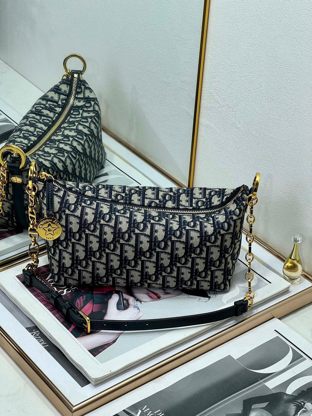 Dior shoulder bag with blue Dior monogram pattern and gold-tone chain straps