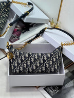 Dior mini shoulder bag with blue Dior logo jacquard pattern and gold-tone chain handle