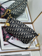 Dior patterned shoulder bag with zip top, gold-tone hardware, and chain crossbody strap