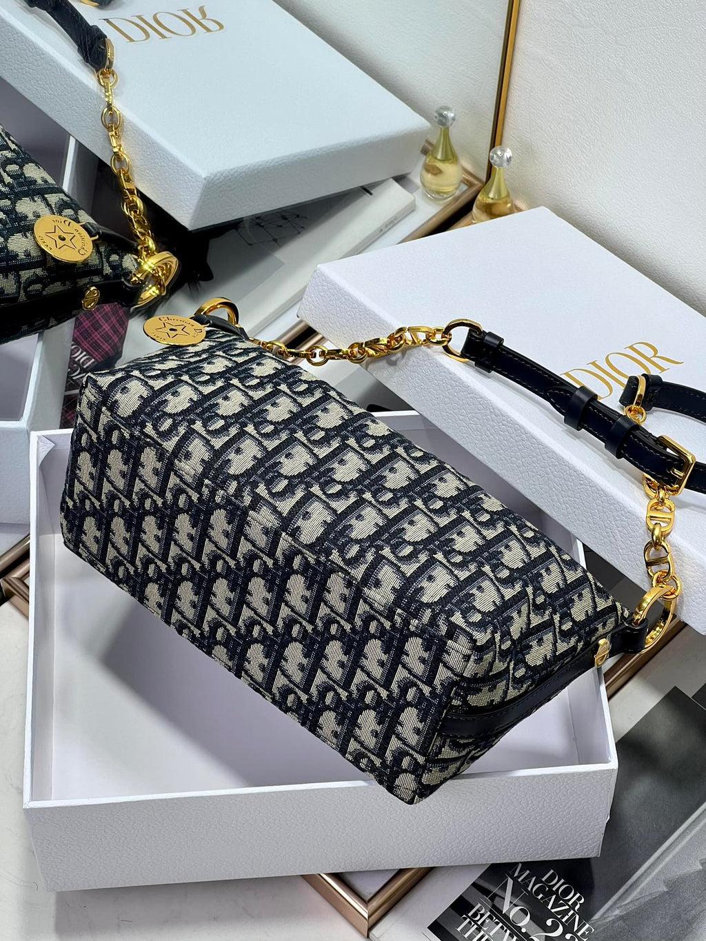 Dior structured shoulder bag with blue monogram print and gold-tone chain crossbody
