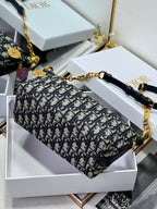 Dior structured shoulder bag with blue monogram print and gold-tone chain crossbody