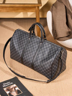 Men's Louis Vuitton checkered duffel bag with long shoulder strap and metal details