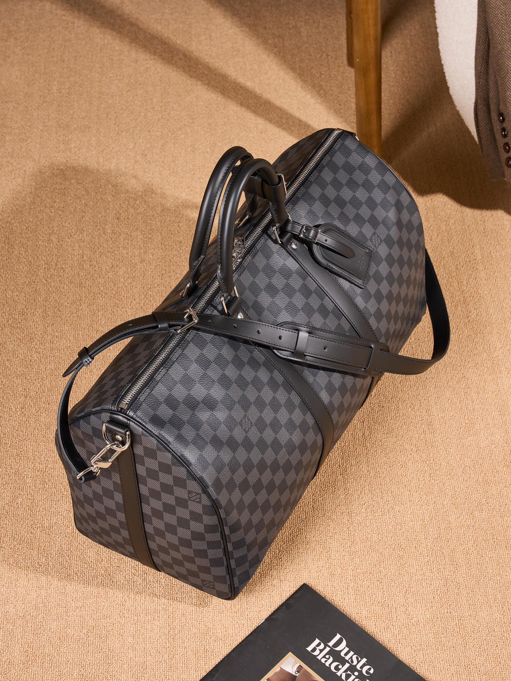 Men's Louis Vuitton checkered duffel bag with luggage strap and shoulder handle