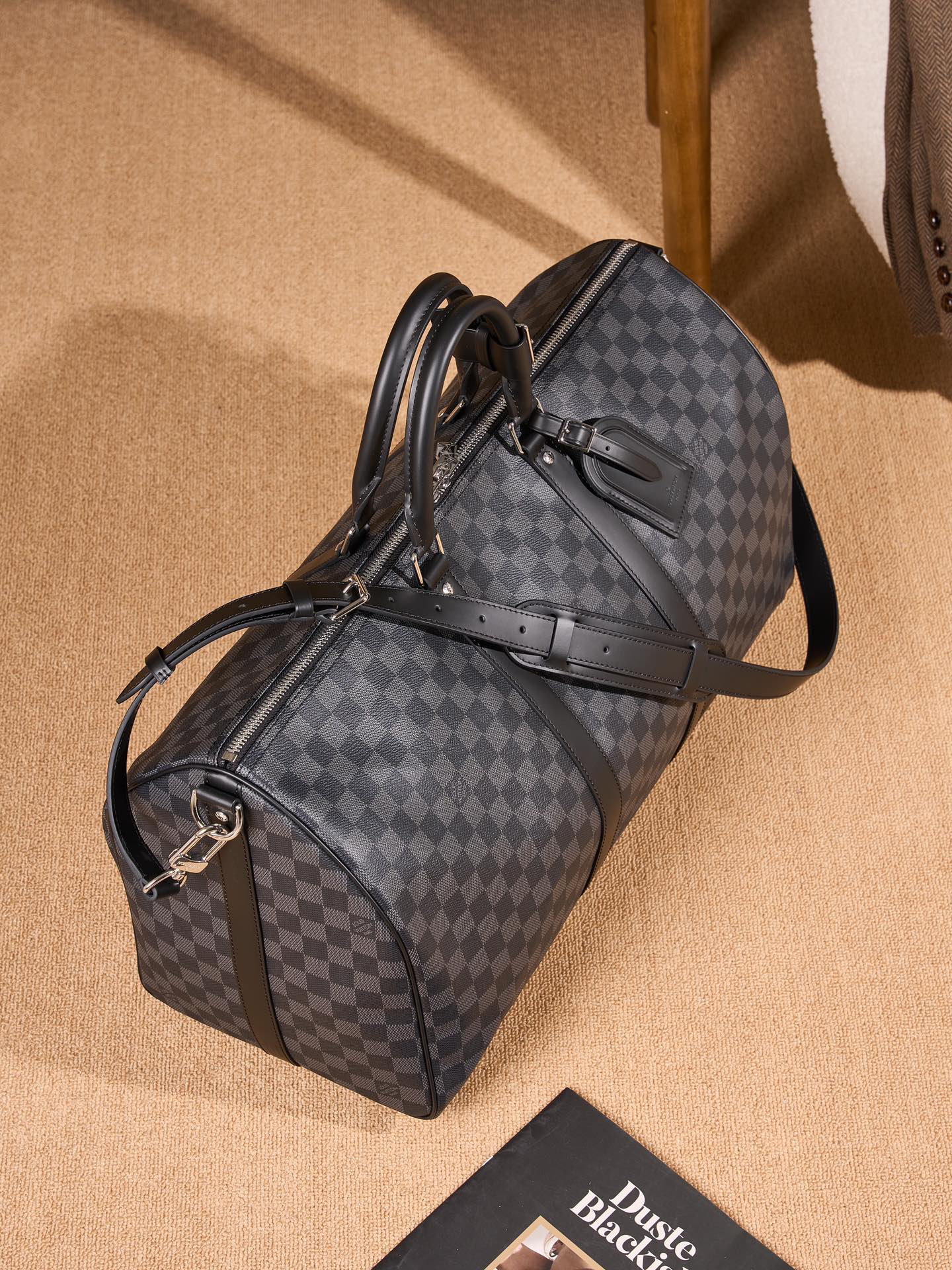 Men's Louis Vuitton checkered duffel bag with luggage strap and shoulder handle