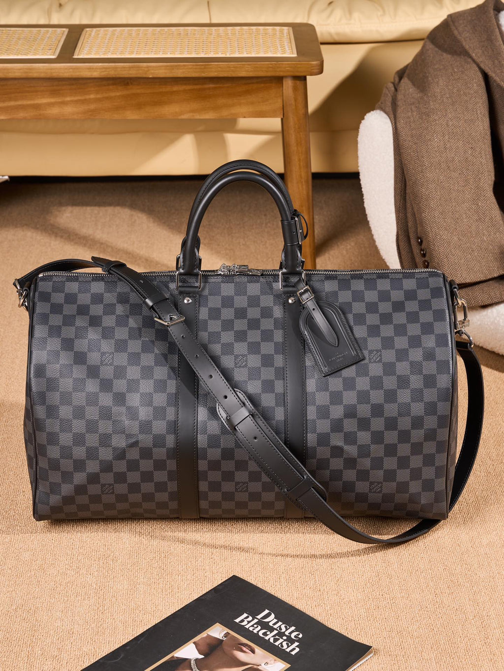 Men's Louis Vuitton checkered duffel bag with top handles and shoulder strap