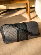 Men's Louis Vuitton duffel bag with monogram canvas and black leather side panels