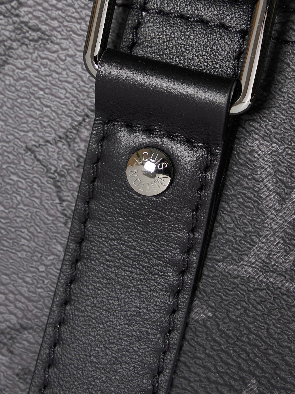 Louis Vuitton duffel bag leather loop with embossed logo on black textured leather