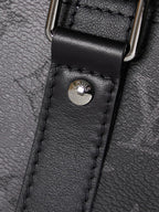Louis Vuitton duffel bag leather loop with embossed logo on black textured leather