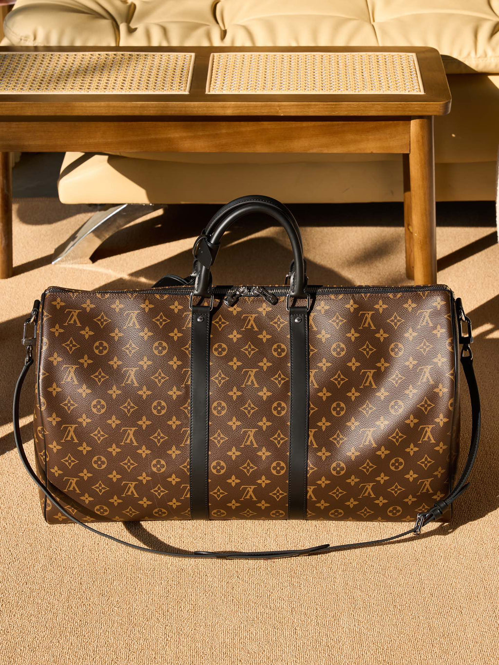 Monogram duffel bag with two top handles and detachable shoulder strap