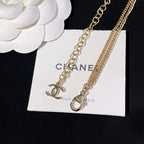 Gold-tone link necklaces with CC pendant and small heart-shaped charm