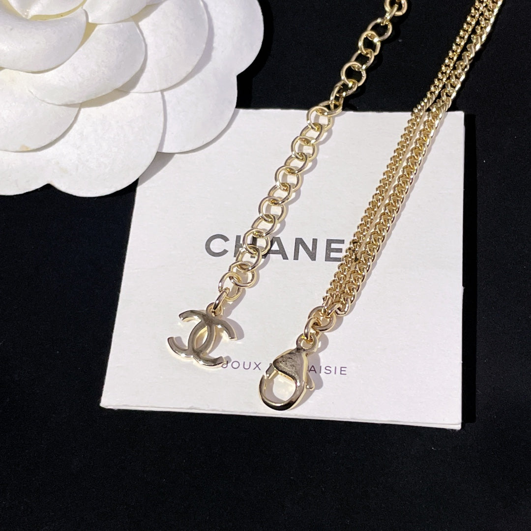 Gold-tone link necklaces with CC pendant and small heart-shaped charm