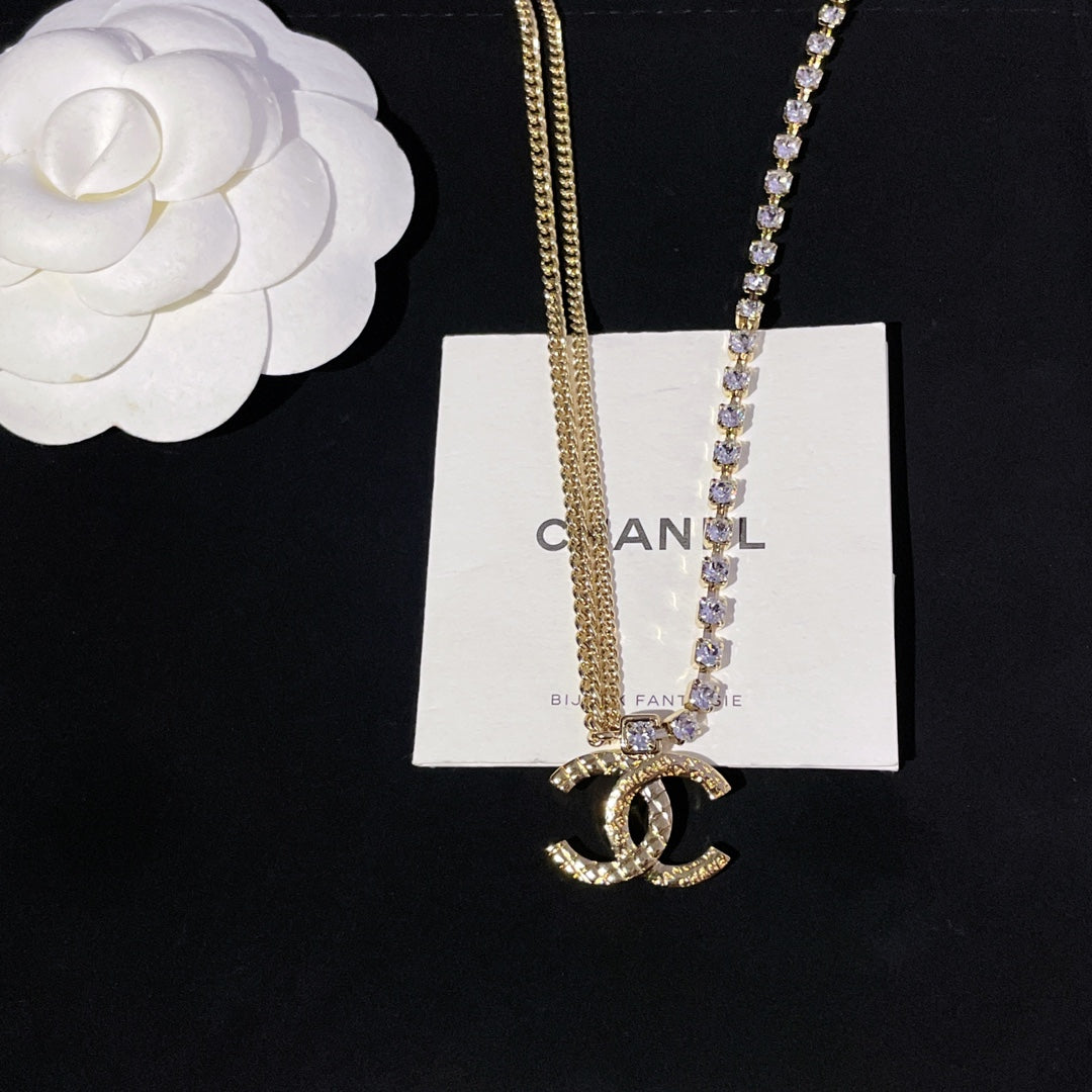 Gold-tone and crystal pendant necklace with CC emblem and jeweled chain