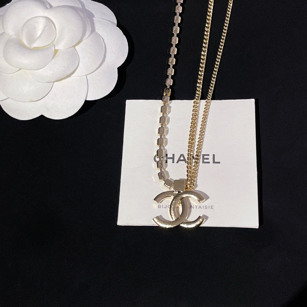 Layered necklaces with gold chain and crystal bead strand with pendant charm