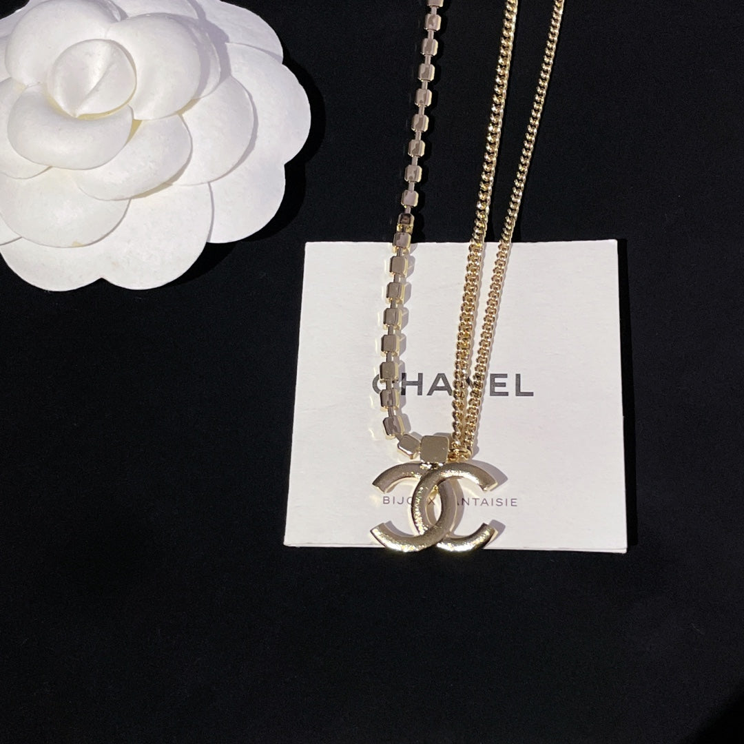 Layered necklaces with gold chain and crystal bead strand with pendant charm