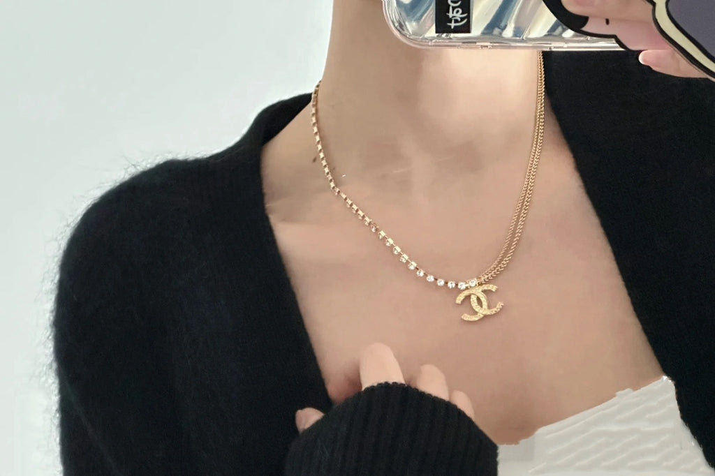 Pearl-bead long necklace with Chanel logo pendant in gold-tone