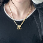 Pearl-bead necklace with large Chanel logo charm, gold-tone