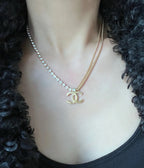 Rhinestone chain necklace with Chanel logo pendant, gold-tone