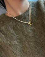 Two-layer pearl-bead necklace with Chanel logo pendant, gold-tone clasp