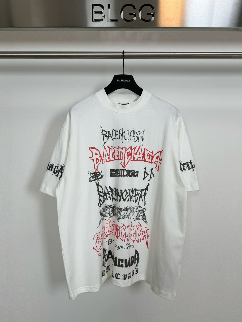 White T-shirt with front graphic print in black, red, and white lettering
