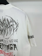 White T-shirt back close-up with black oval graphic and red script detail