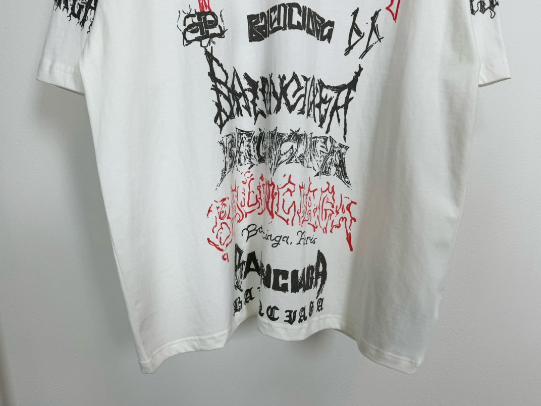 White T-shirt front close-up showing red and black script graphic