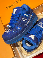Blue lace-up sneakers with rhinestone trim and raised side emblem