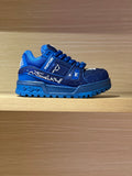 Blue athletic sneakers with rhinestone logo accents and lace-up front