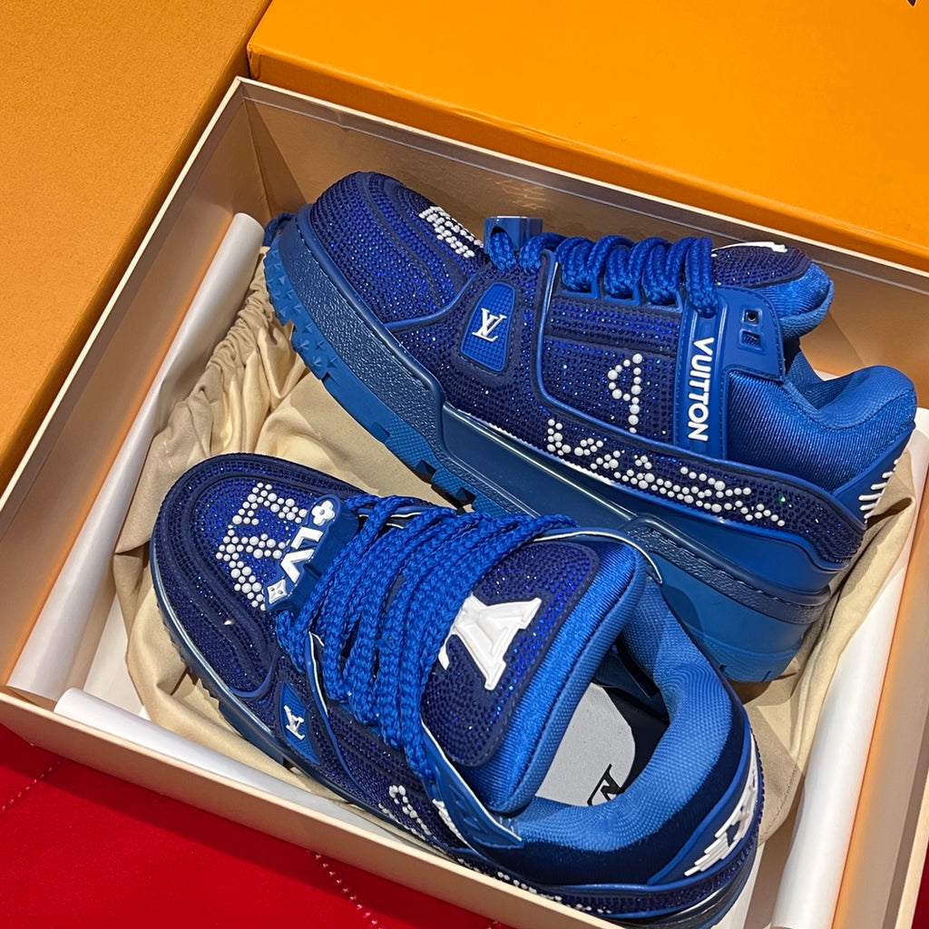 Blue lace-up sneakers in box with rhinestone logo and thick rubber sole