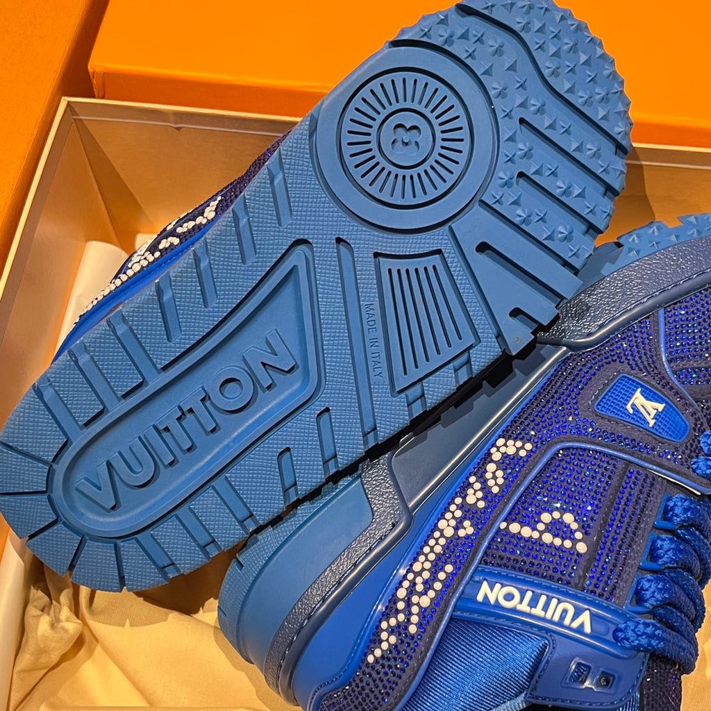 Blue sneaker outsole with Vuitton lettering and chunky traction tread