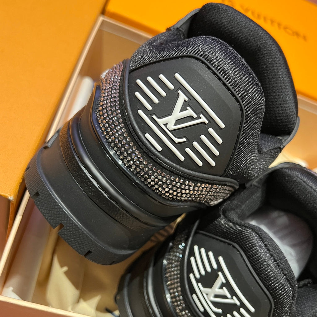 Black Louis Vuitton sneaker heel with molded logo patch and rhinestone trim