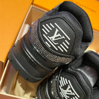 Black Louis Vuitton sneaker heel with molded logo patch and rhinestone trim
