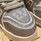 Close-up of Louis Vuitton trainer toe and side, silver studded mesh with lace detail