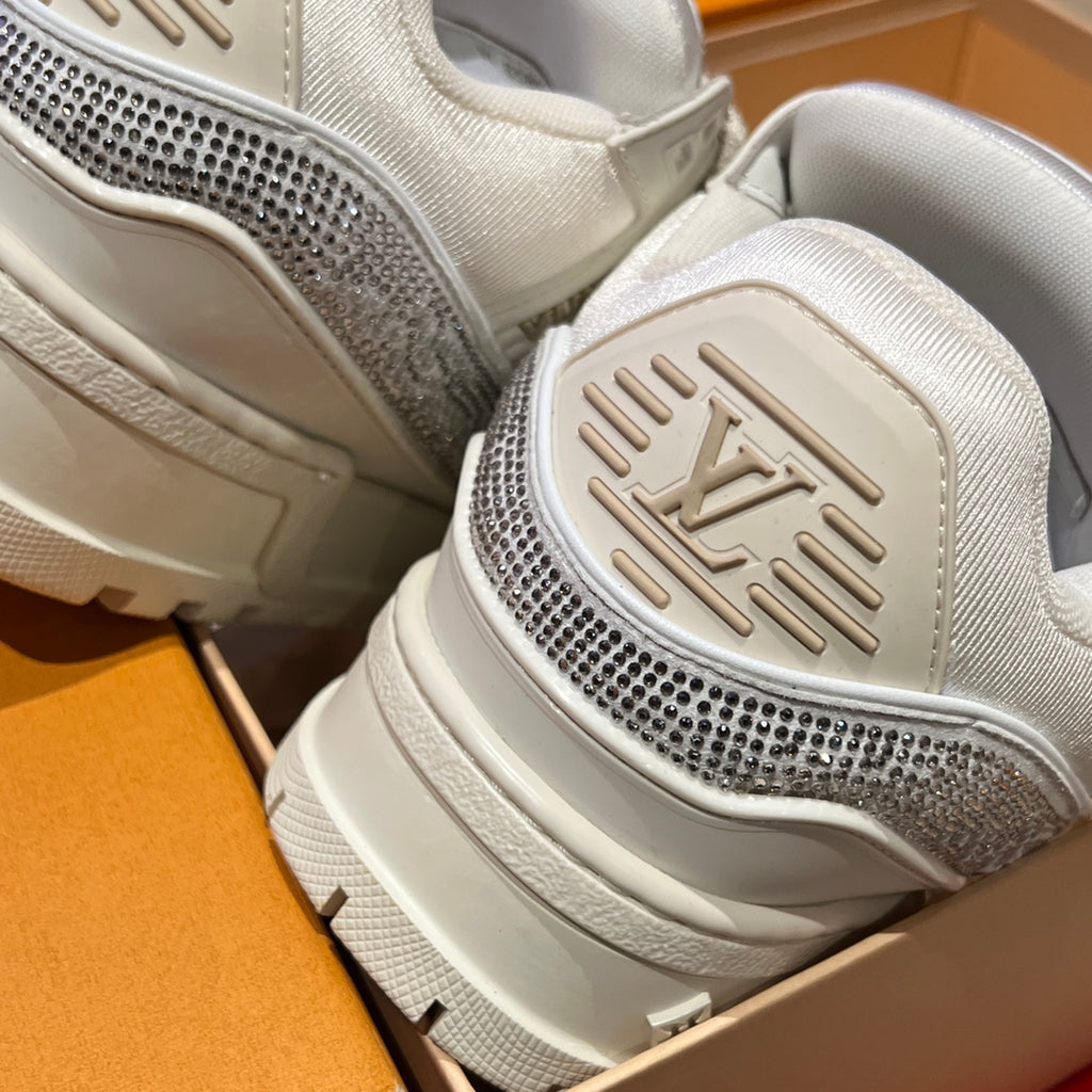 Close-up of Louis Vuitton trainer heel and sole, white tread with logo accent