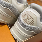 Close-up of Louis Vuitton trainer heel and sole, white tread with logo accent