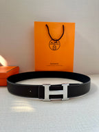 Hermes leather belt, dark strap with centered silver buckle and end prong
