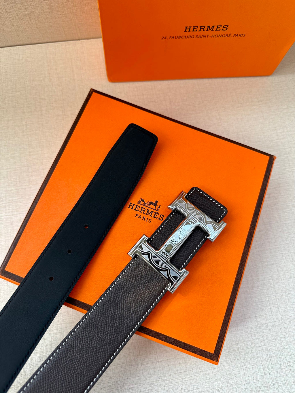 Hermes leather belt, dark strap with silver buckle, stitched edge and embossed detail