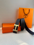 Hermes leather belt, dark strap with silver buckle and prong, length shown