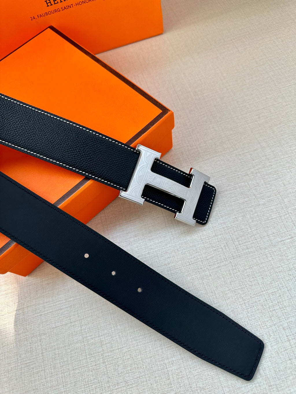 Hermes reversible-style belt, dark navy leather with silver buckle and multiple holes