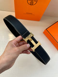 Hermes leather belt, dark navy textured strap, silver H buckle with pin closure
